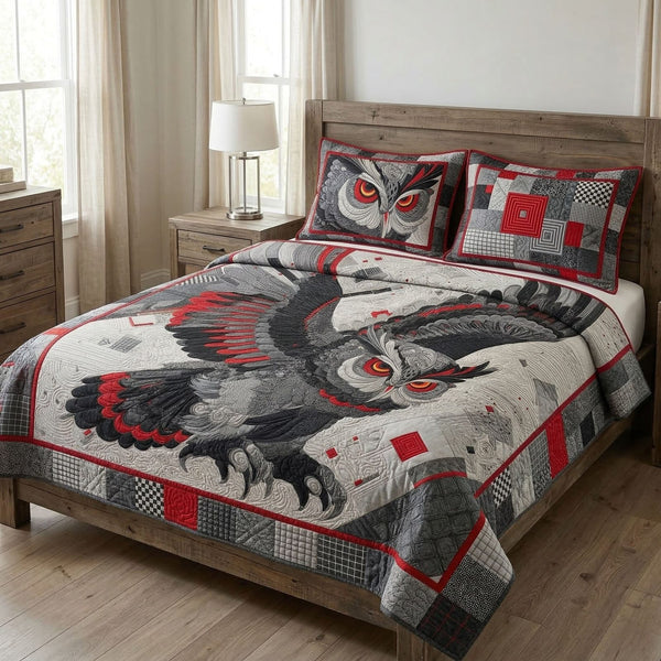 Night Watcher quilted 3-piece bedding set on a made bed with two matching pillow shams