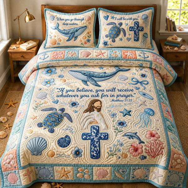 Ocean Bible Quote quilted 3-piece bedding set on a made bed in a softly lit bedroom