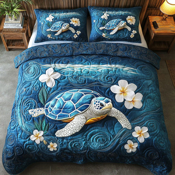 Ocean Shell Echo quilted 3-piece bedding set on a made bed in a light coastal bedroom