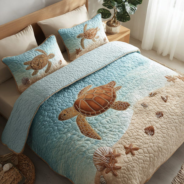 Ocean Turtle quilted 3-piece bedding set on a made bed in a light coastal bedroom