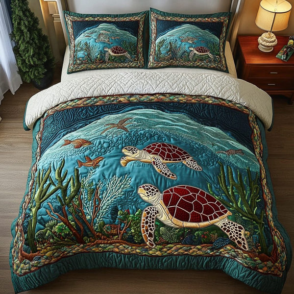 Ocean Wanderer quilted 3-piece bedding set on a made bed in a light coastal bedroom