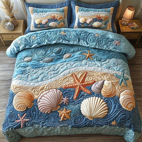 Oceanic Love quilted 3-piece bedding set on a made bed in a light coastal bedroom