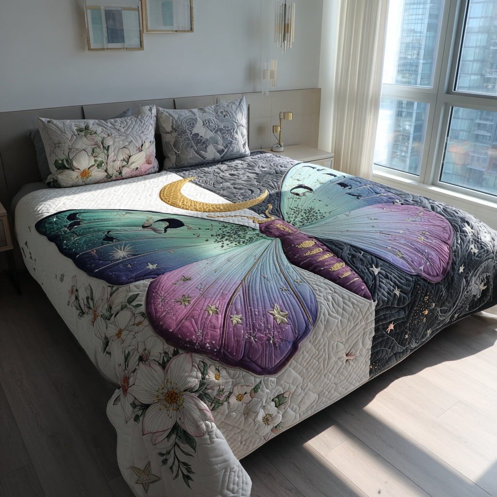 Ombre Moth quilted 3-piece bedding set on a made bed with two matching pillow shams