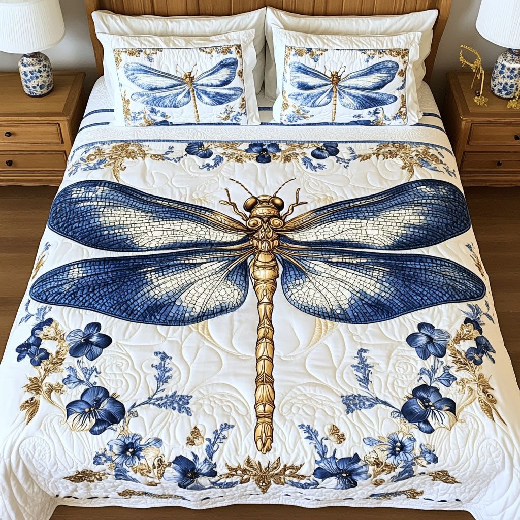 Ornate Elegance quilted 3-piece bedding set on a made bed with two matching pillow shams