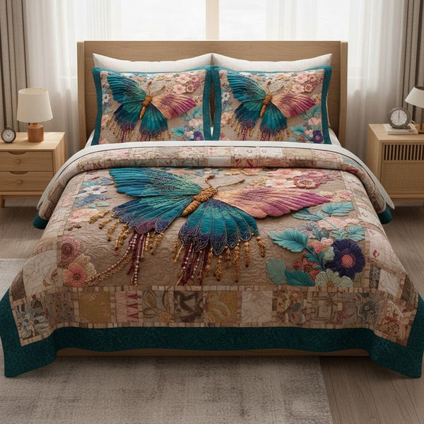 Pearlwing quilted 3-piece bedding set on a made bed with two matching pillow shams
