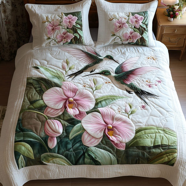 Petal Bliss quilted 3-piece bedding set on a made bed with two matching pillow shams