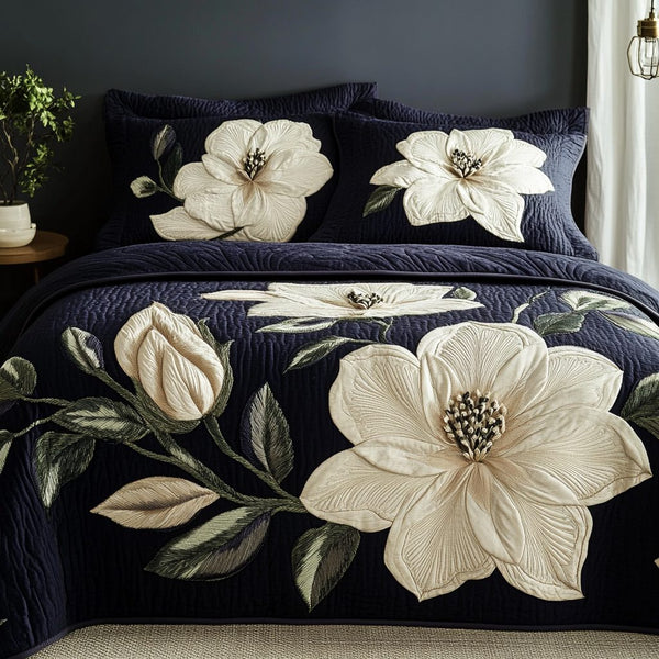 Petal Elegance quilted 3-piece bedding set on a made bed with two matching pillow shams