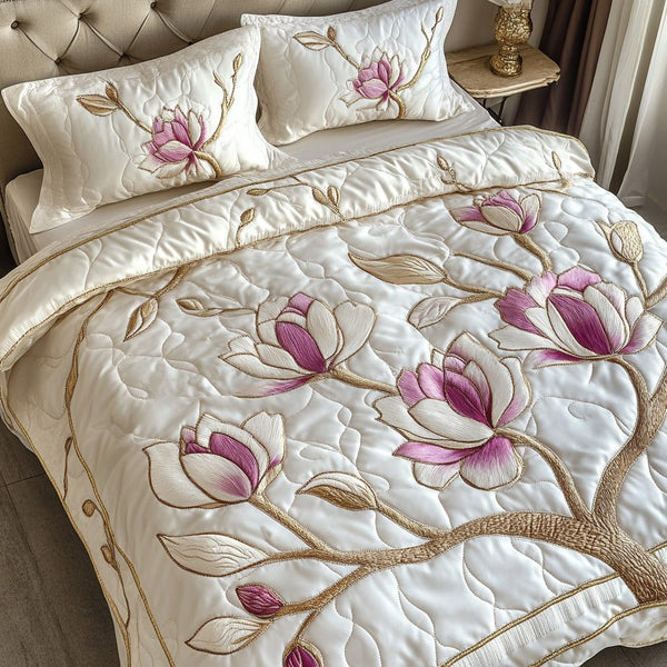 Pink Magnolia Serenity quilted 3-piece bedding set on a made bed with two matching pillow shams