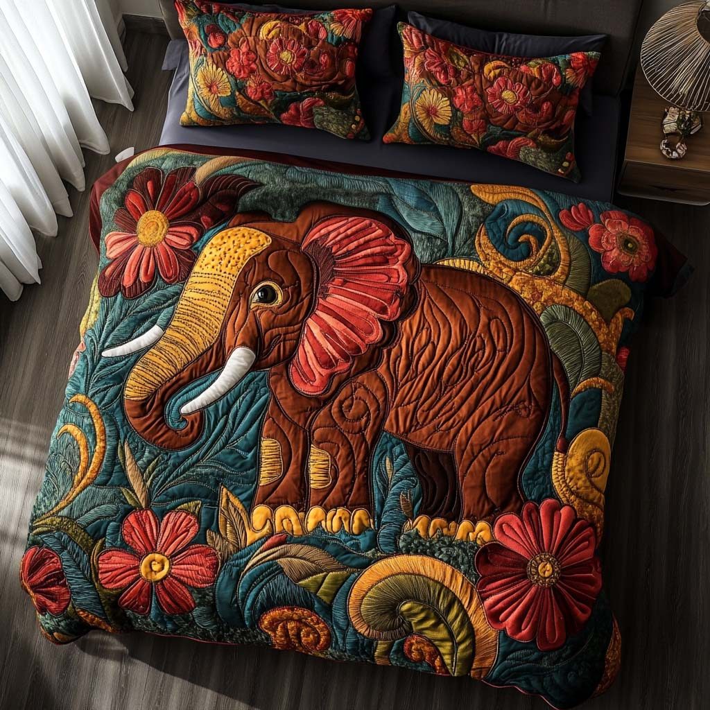 Playful Elephant Hugs quilted 3-piece bedding set on a made bed with two matching pillow shams