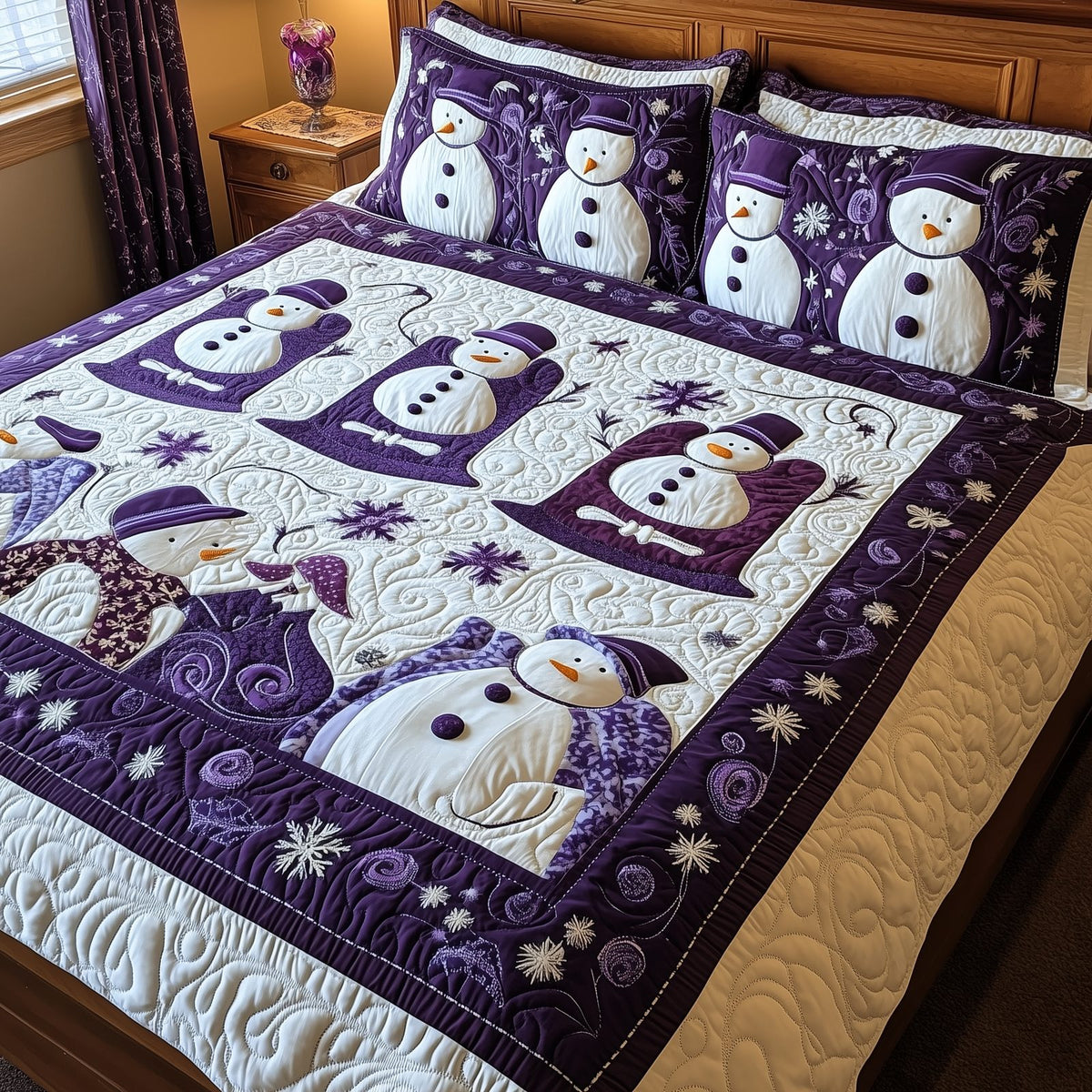 Purple Joy quilted 3-piece bedding set on a made bed with two matching pillow shams