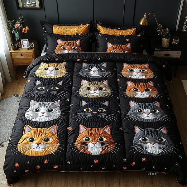 Purrfectly Cozy quilted 3-piece bedding set on a made bed with two matching pillow shams