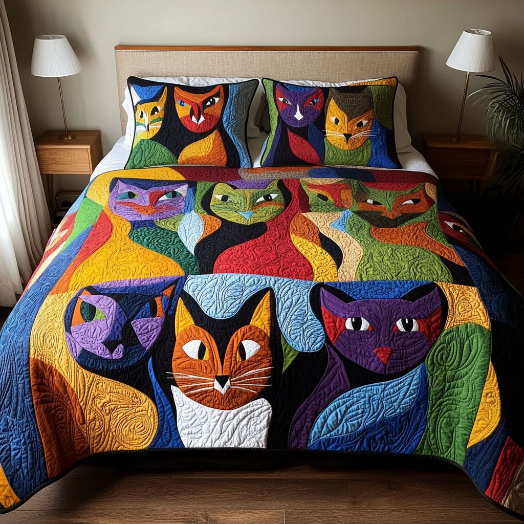 Purrfectly Playful quilted 3-piece bedding set on a made bed with two matching pillow shams