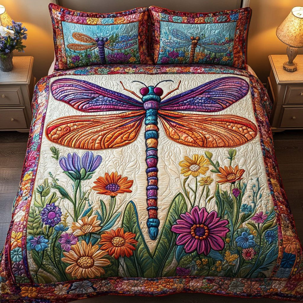 Rainbow Dragonfly quilted 3-piece bedding set on a made bed with two matching pillow shams