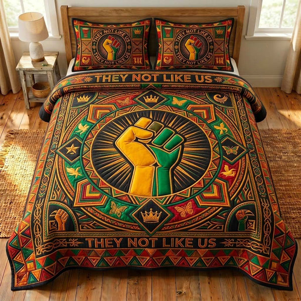 Raised Pride quilted 3-piece bedding set on a made bed with two matching pillow shams