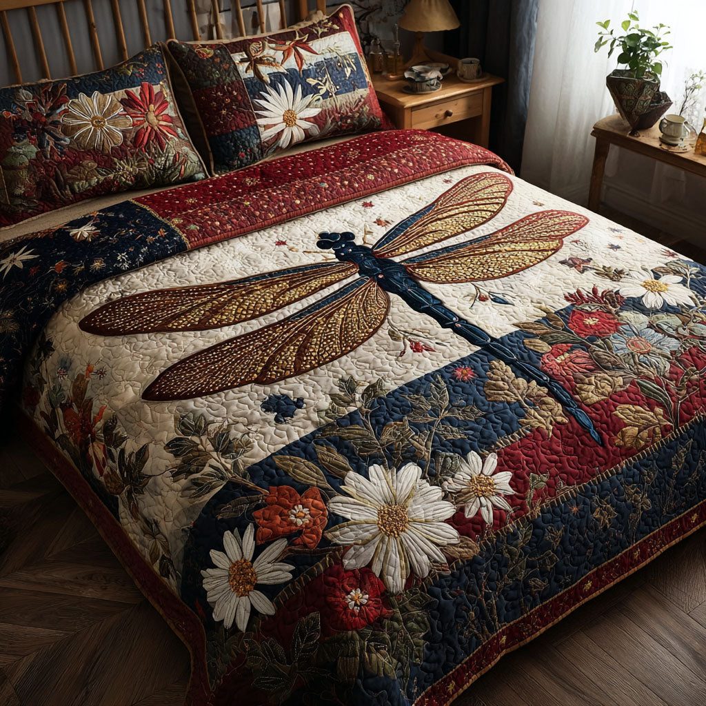 Red White and Blue Wings quilted 3-piece bedding set on a made bed with two matching pillow shams