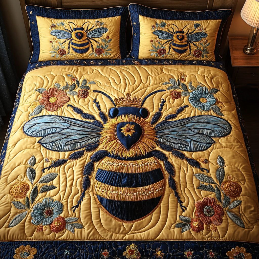 Royal Bee Majesty quilted 3-piece bedding set on a made bed with two matching pillow shams