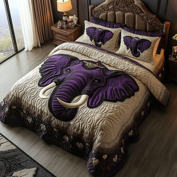 Royal Elephant Embrace quilted 3-piece bedding set on a made bed with two matching pillow shams