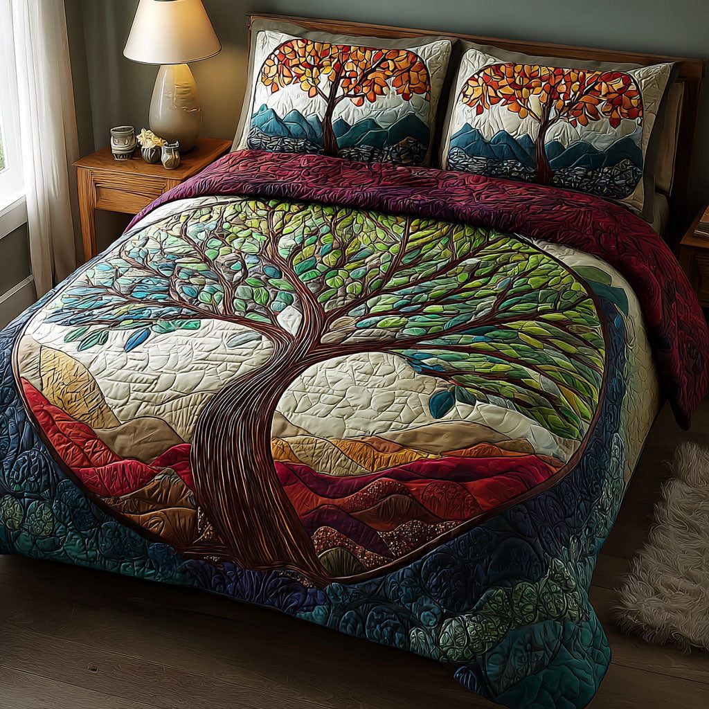 Sacred Tree quilted 3-piece bedding set on a made bed in a softly lit bedroom
