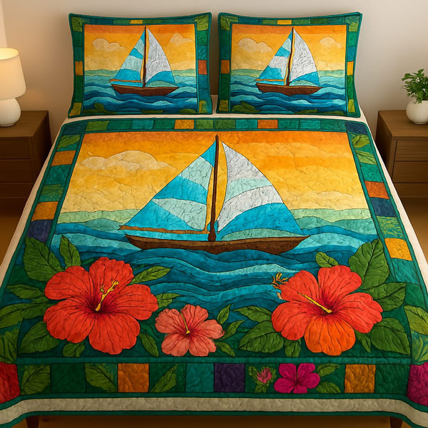 Sail Away quilted 3-piece bedding set on a made bed in a light coastal bedroom