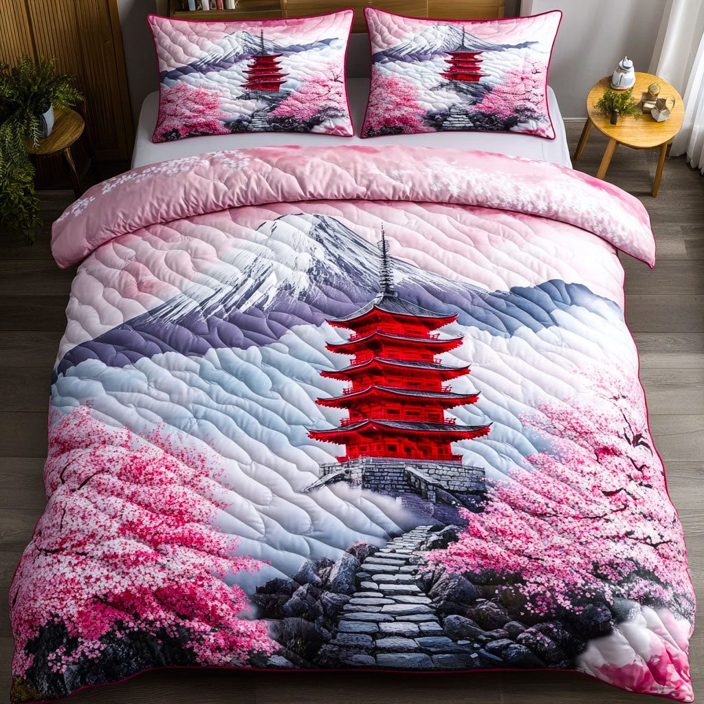 Sakura Journey quilted 3-piece bedding set on a made bed with two matching pillow shams