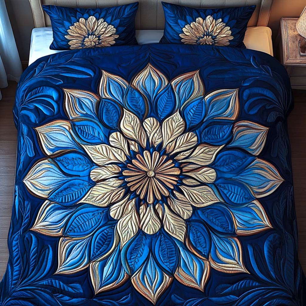Sapphire Glow quilted 3-piece bedding set on a made bed with two matching pillow shams