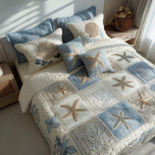 Sea Breeze quilted 3-piece bedding set on a made bed in a light coastal bedroom
