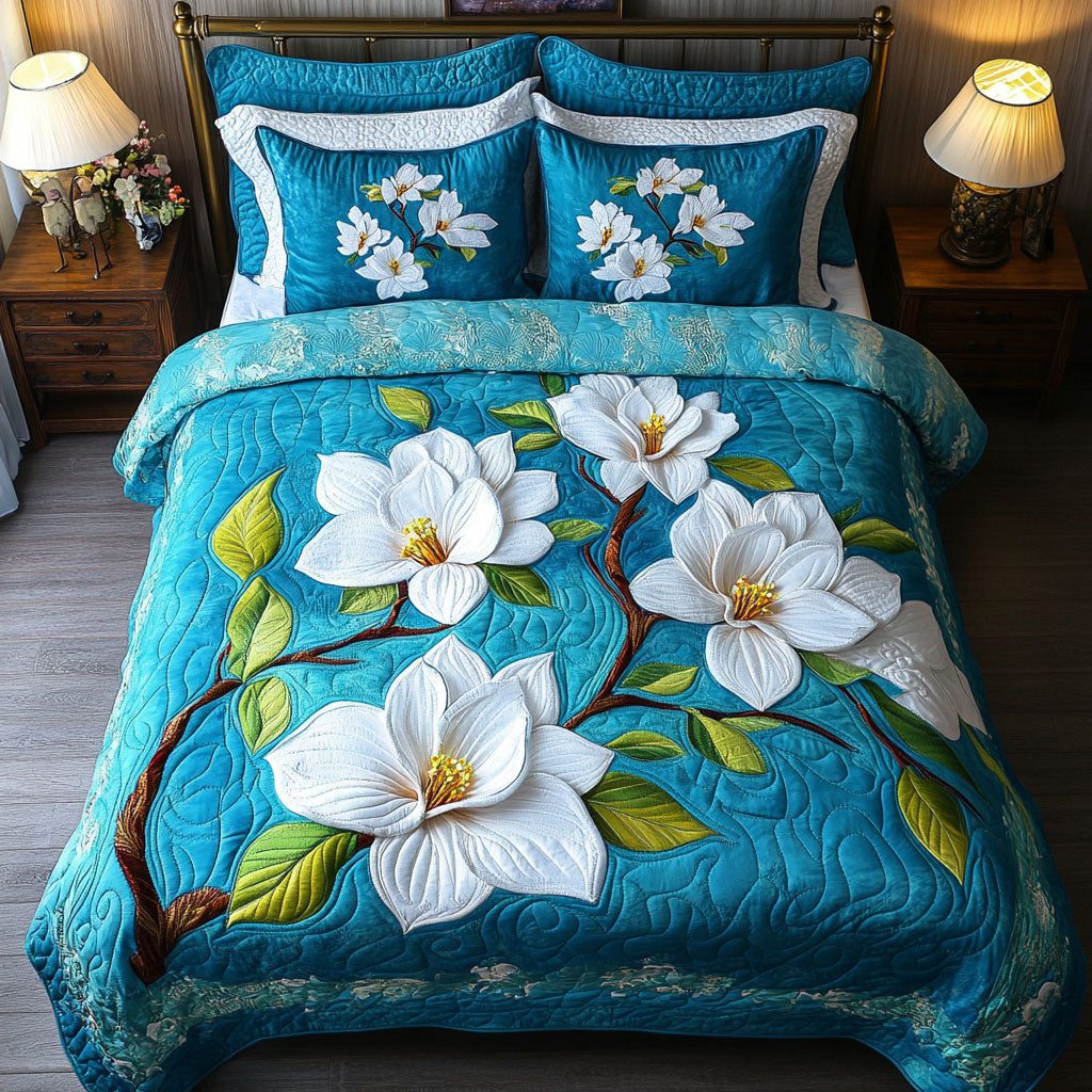 Serenity Blue quilted 3-piece bedding set on a made bed with two matching pillow shams