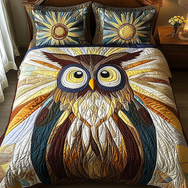 Shining Owl quilted 3-piece bedding set on a made bed with two matching pillow shams