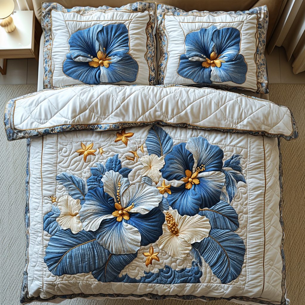 Silver Blue Radiance quilted 3-piece bedding set on a made bed with two matching pillow shams