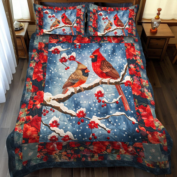 Snow Cardinal quilted 3-piece bedding set on a made bed with two matching pillow shams