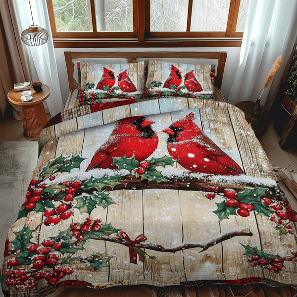 Snowy Cardinal Serenity quilted 3-piece bedding set on a made bed with two matching pillow shams