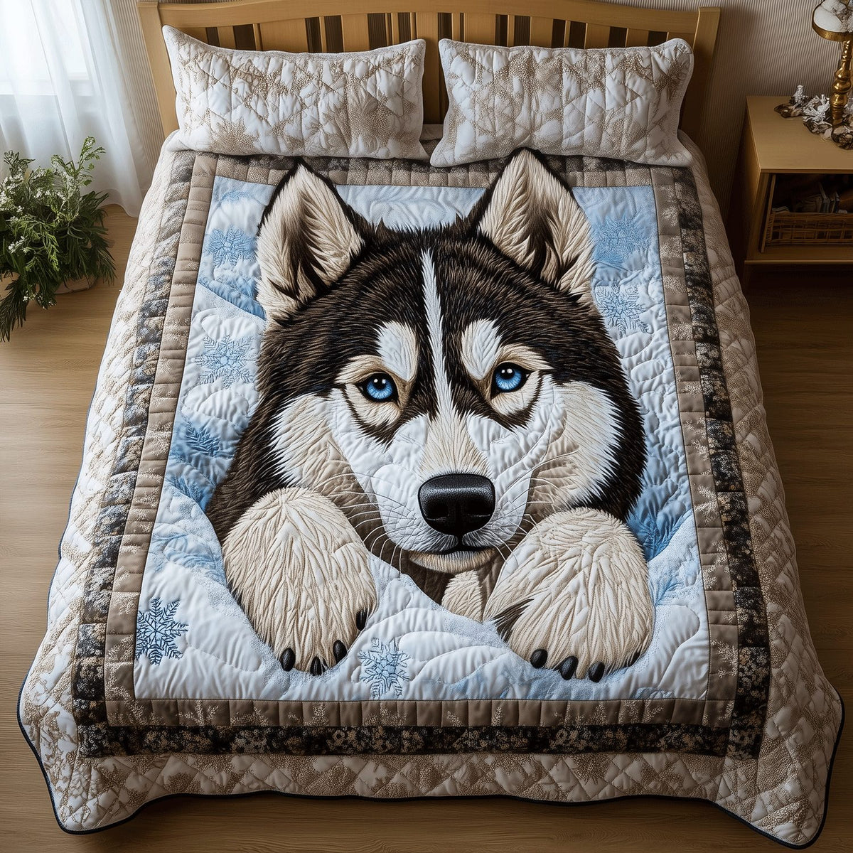 Snowy Husky Paws quilted 3-piece bedding set on a made bed with two matching pillow shams