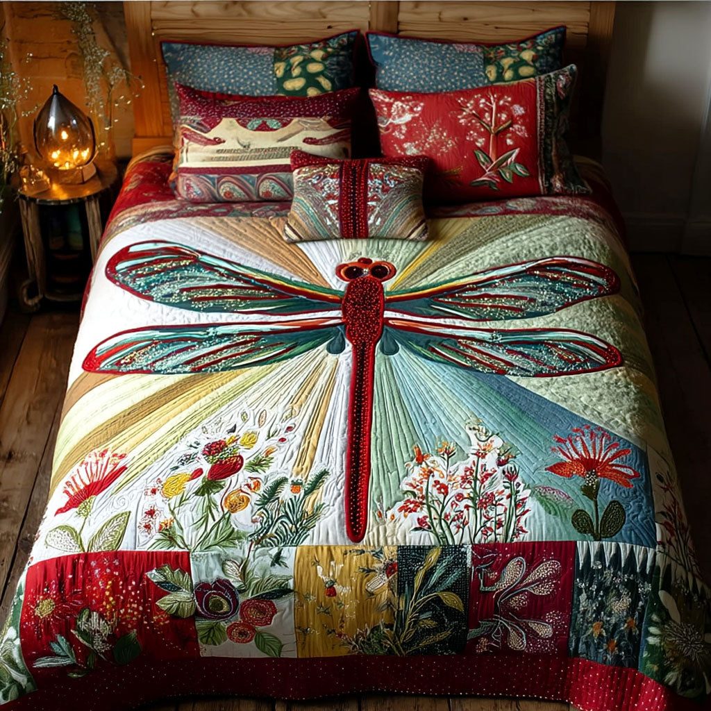 Solstice Dragonfly quilted 3-piece bedding set on a made bed with two matching pillow shams