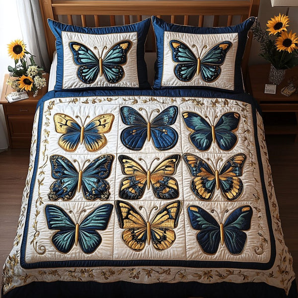 Soothing Wings quilted 3-piece bedding set on a made bed with two matching pillow shams