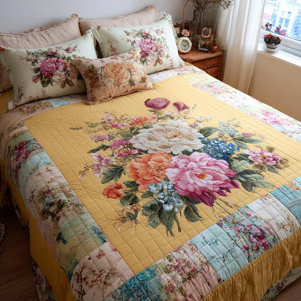 Spring Petals quilted 3-piece bedding set on a made bed with two matching pillow shams