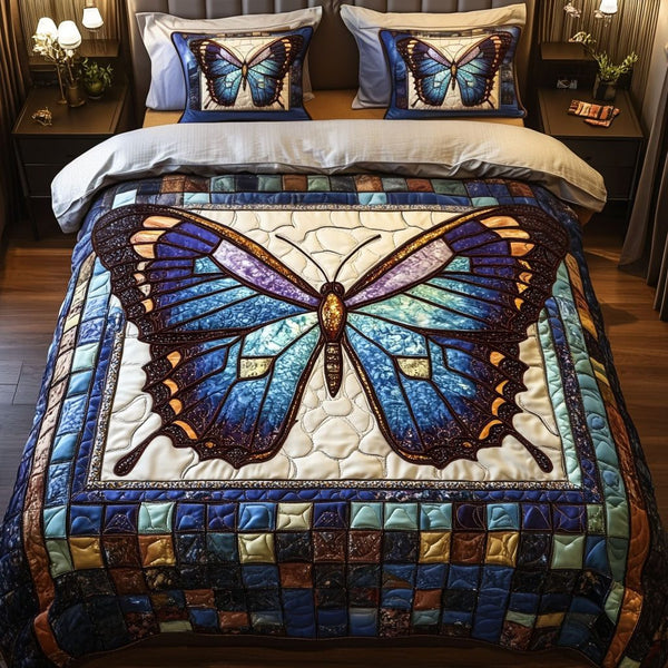 Stained Glass Butterfly quilted 3-piece bedding set on a made bed with two matching pillow shams