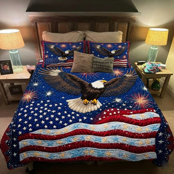 Star Banner quilted 3-piece bedding set on a made bed with two matching pillow shams