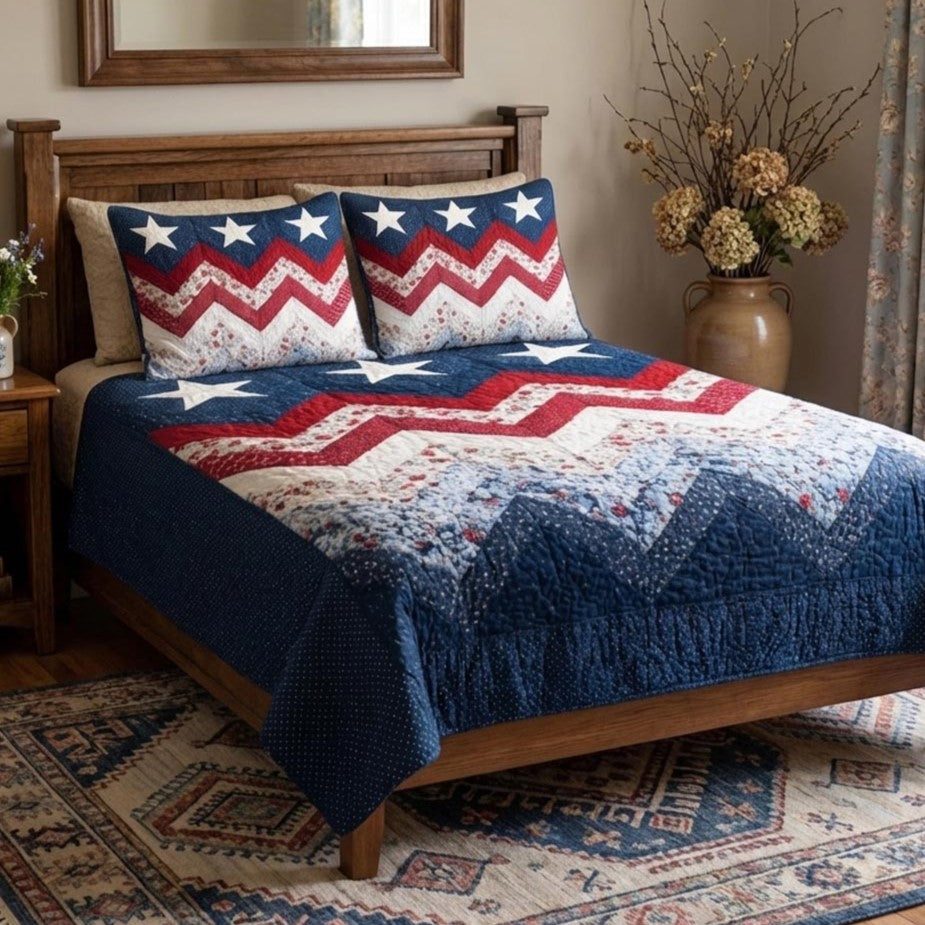 Stars Forever quilted 3-piece bedding set on a made bed with two matching pillow shams