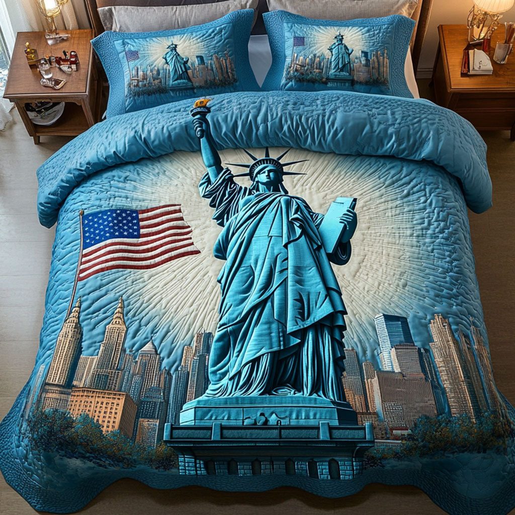 Statue Glory quilted 3-piece bedding set on a made bed with two matching pillow shams