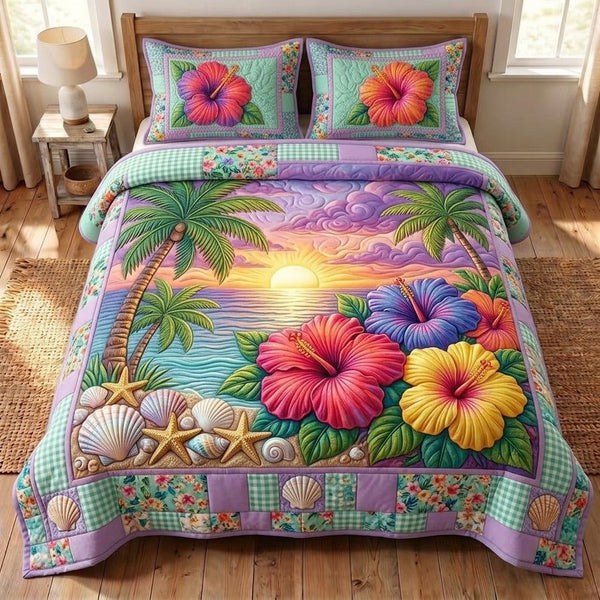 Summer Hibiscus quilted 3-piece bedding set on a made bed with two matching pillow shams