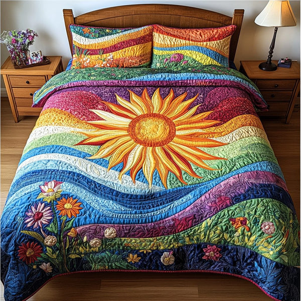 Sunburst Bliss quilted 3-piece bedding set on a made bed with two matching pillow shams