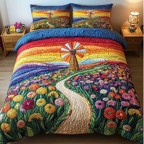 Sunlit Meadows quilted 3-piece bedding set on a made bed with two matching pillow shams