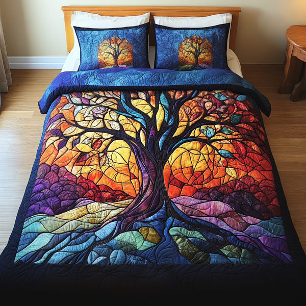 Sunrise Canopy quilted 3-piece bedding set on a made bed with two matching pillow shams