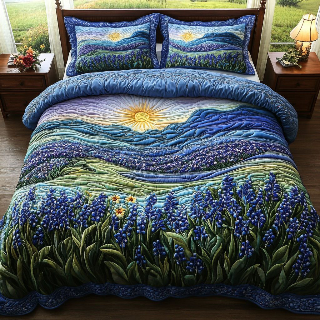 Sunset Bluebonnet quilted 3-piece bedding set on a made bed with two matching pillow shams