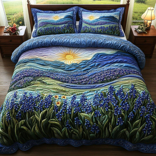 Sunset Bluebonnet quilted 3-piece bedding set on a made bed with two matching pillow shams