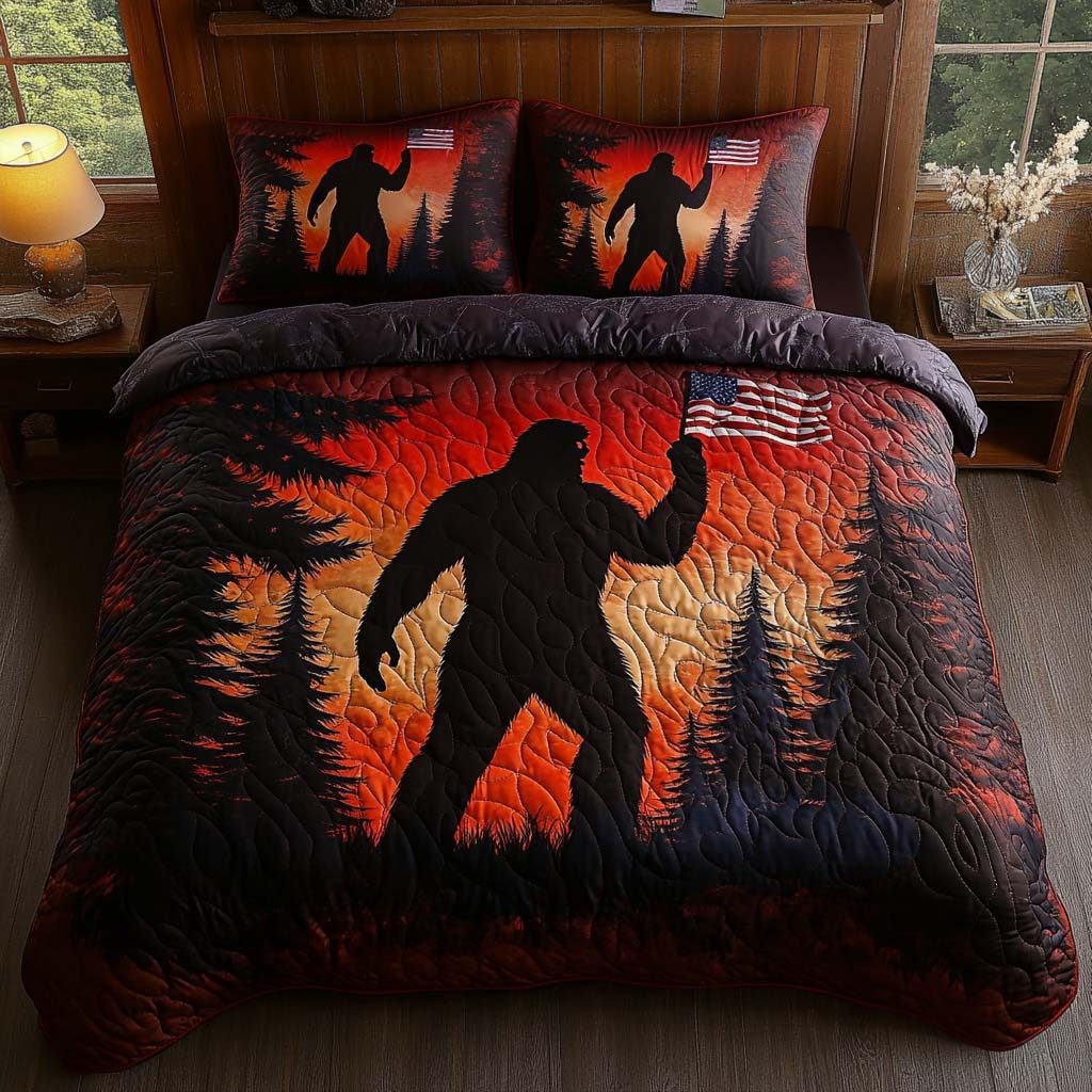 Sunset Sasquatch quilted 3-piece bedding set on a made bed with two matching pillow shams