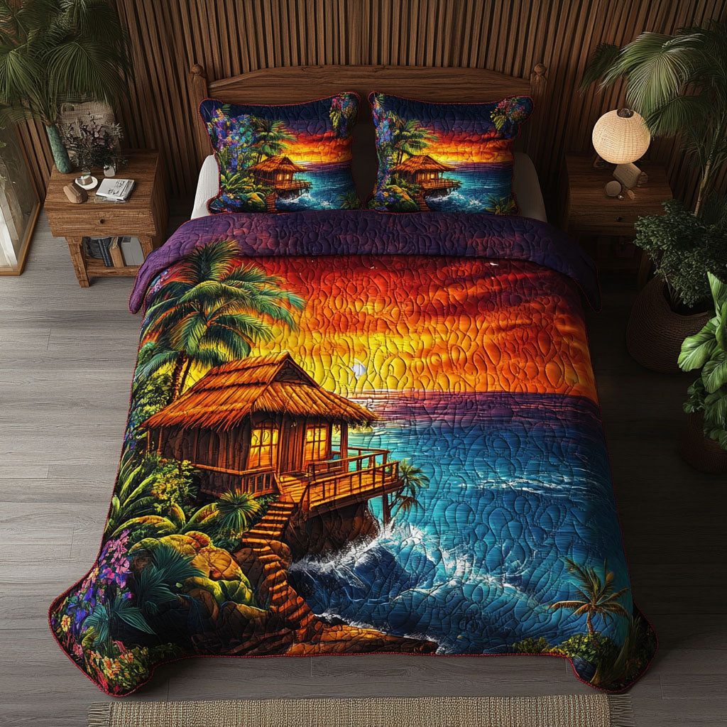 Sunset Seaside Cottage quilted 3-piece bedding set on a made bed in a light coastal bedroom