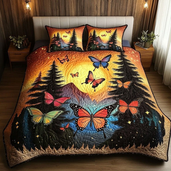 Sunset Wings quilted 3-piece bedding set on a made bed with two matching pillow shams