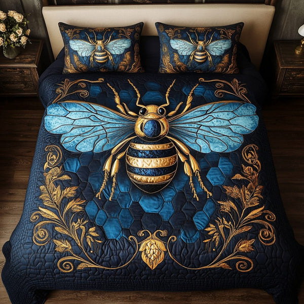 Sweet Hive quilted 3-piece bedding set on a made bed with two matching pillow shams