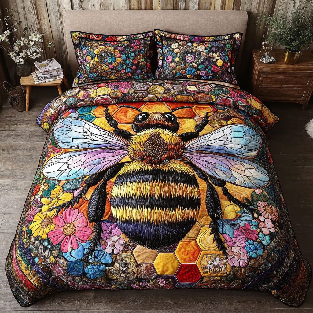 Sweet Nectar quilted 3-piece bedding set on a made bed with two matching pillow shams